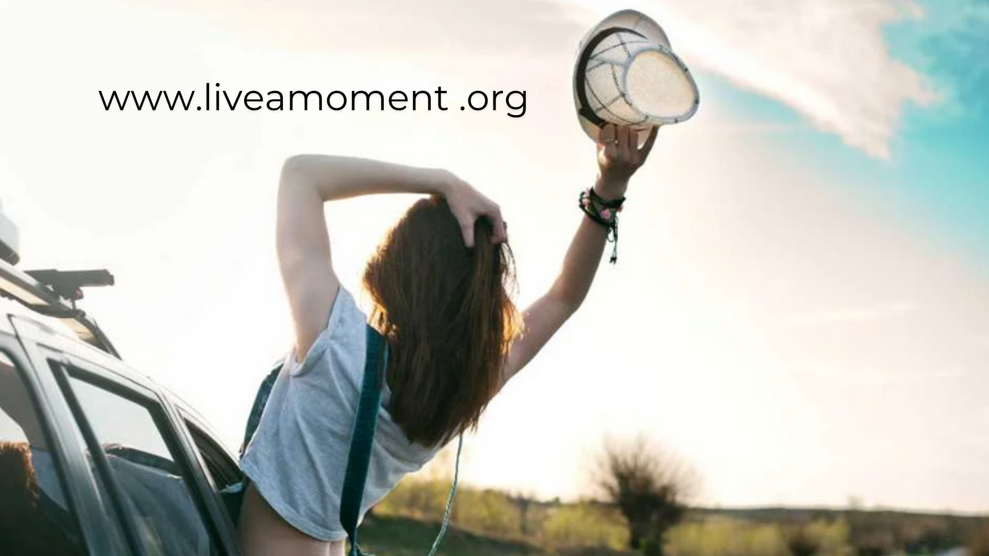 Person practicing mindfulness or meditation, showcasing the mental well-being resources provided by www.LiveAMoment.org